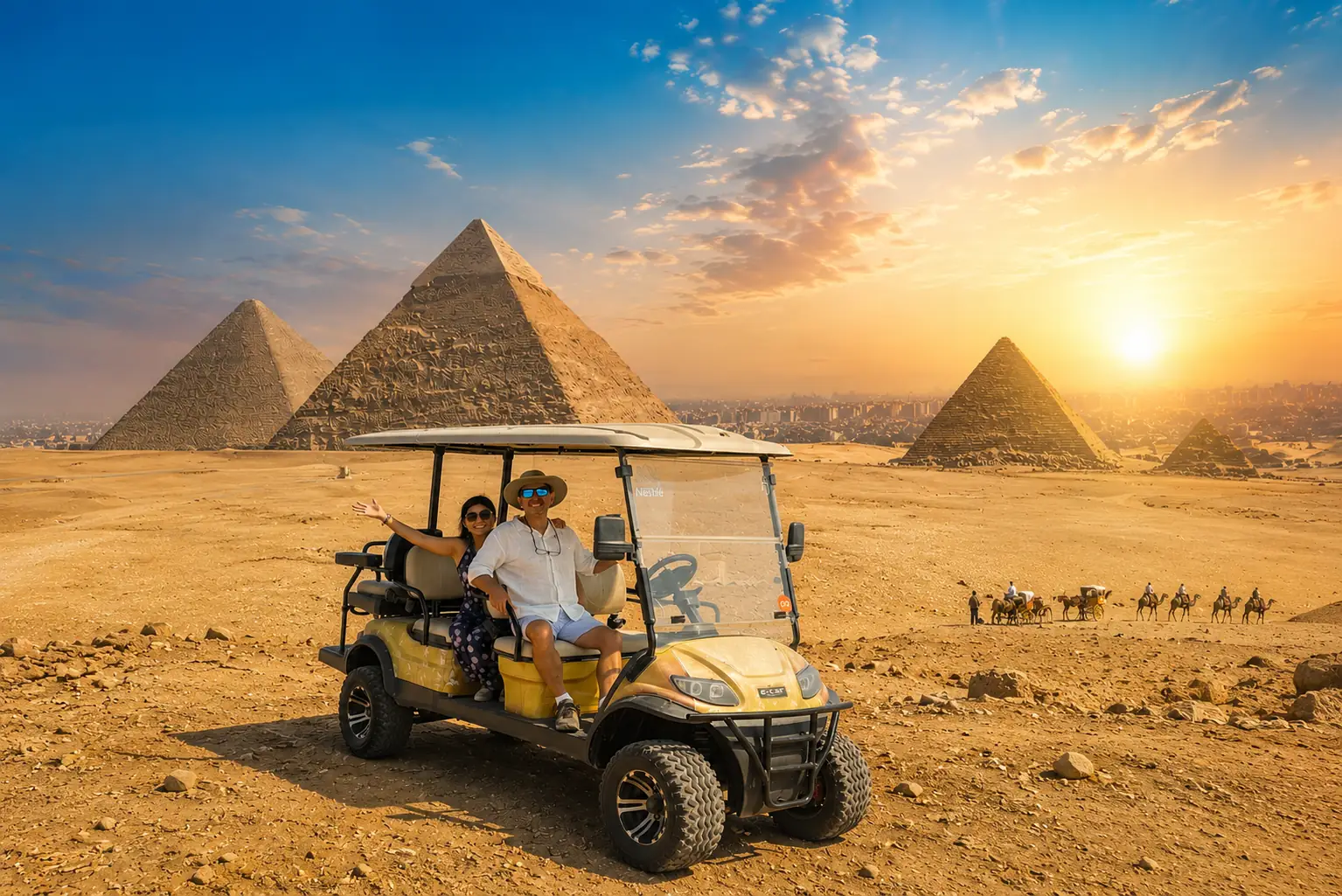 Couple riding a private golf cart at the Giza pyramids at sunset